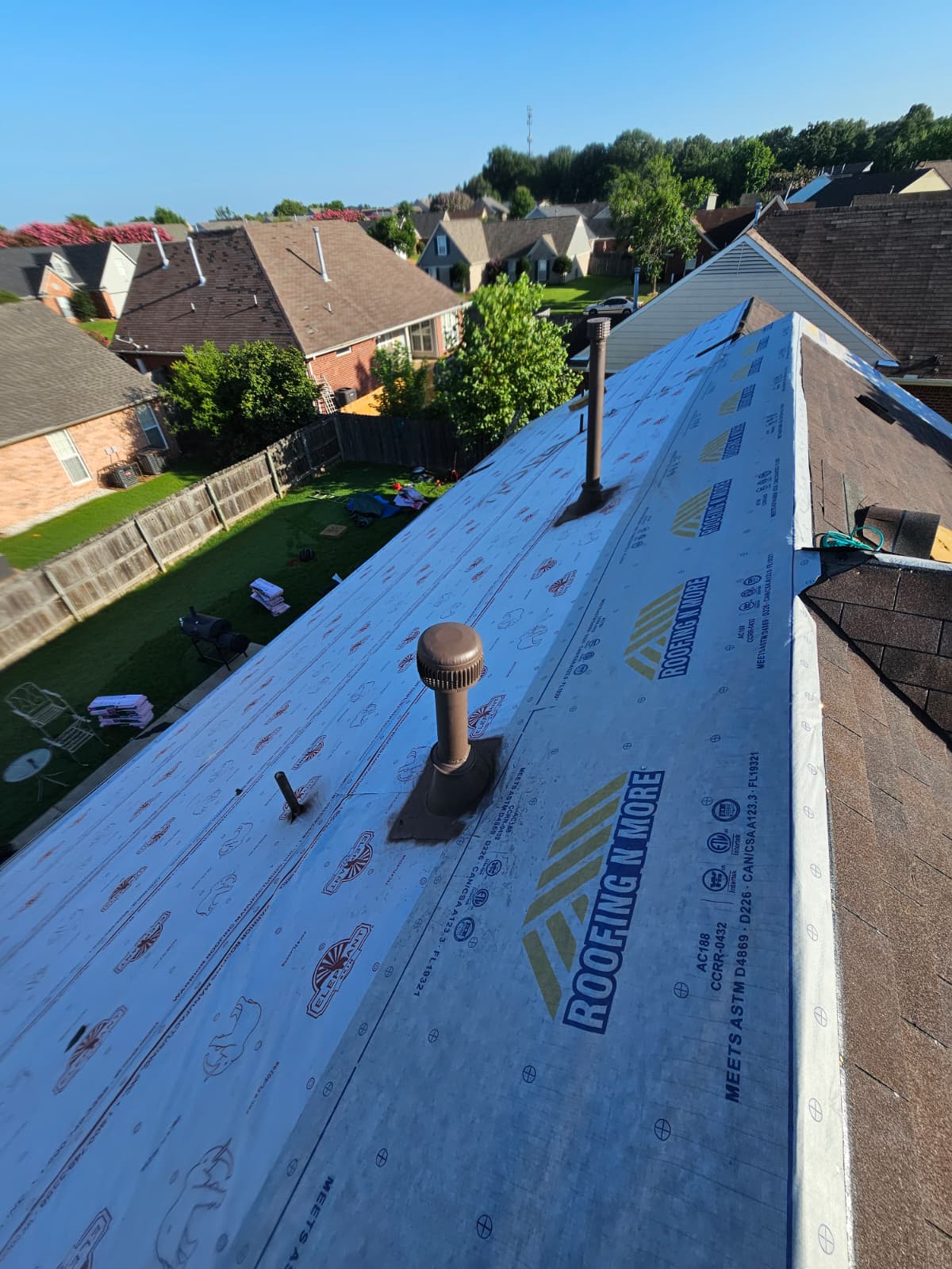 Residential roof replacement in progress — new underlayment installed
